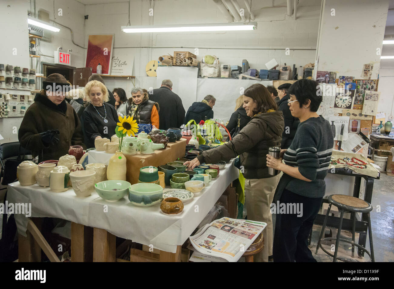 Members of a pottery studio in the New York neighborhood of Chelsea hold a holiday sale prior to Christmas Stock Photo