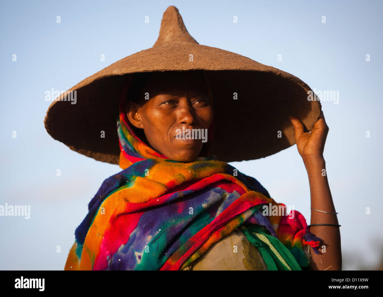 Portrait Of A Oromo Woman Using The Cover Of An Injera Plate As A Hat, Dire Dawa, Ethiopia Stock Photo