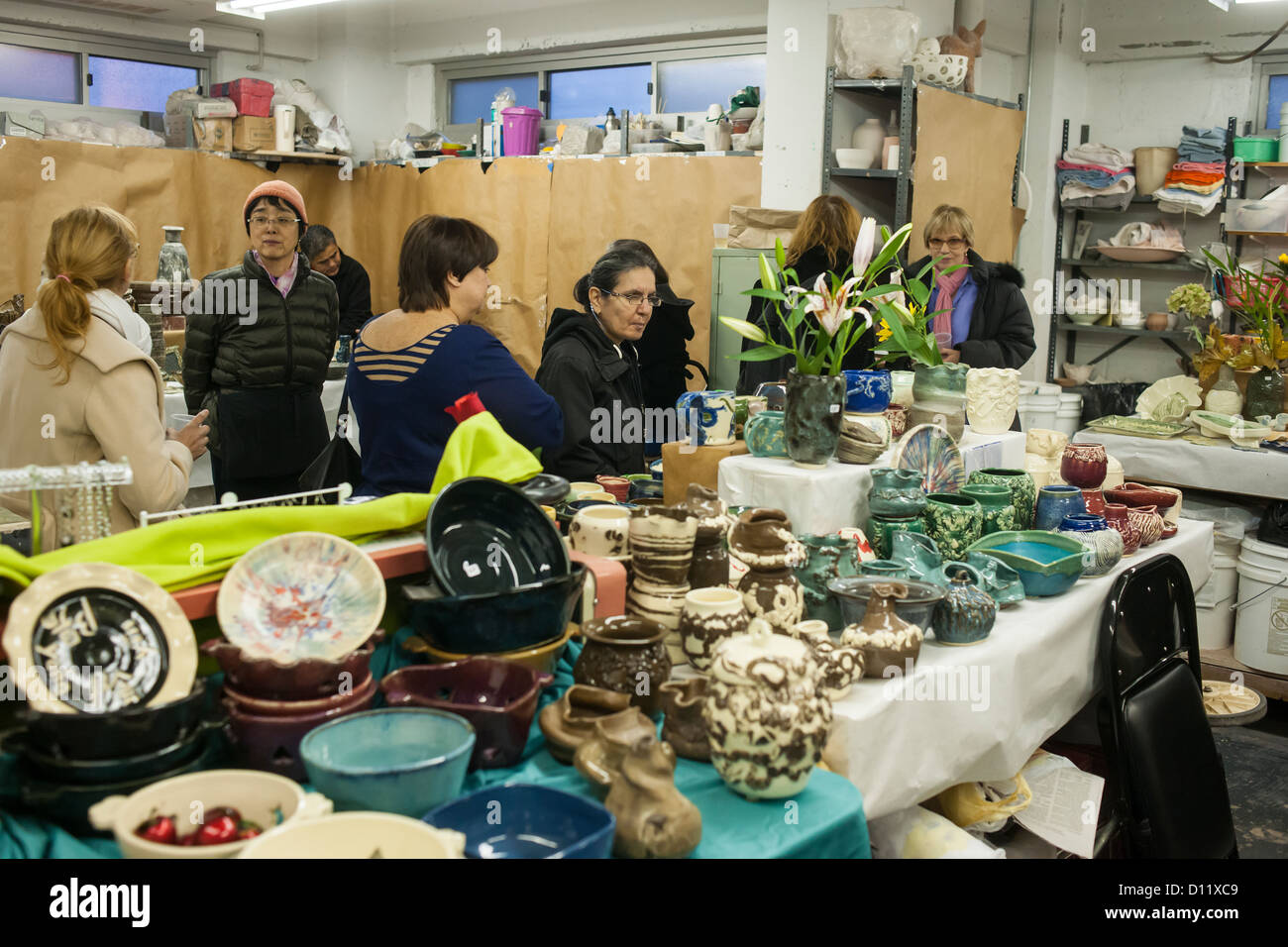 Members of a pottery studio in the New York neighborhood of Chelsea hold a holiday sale prior to Christmas Stock Photo