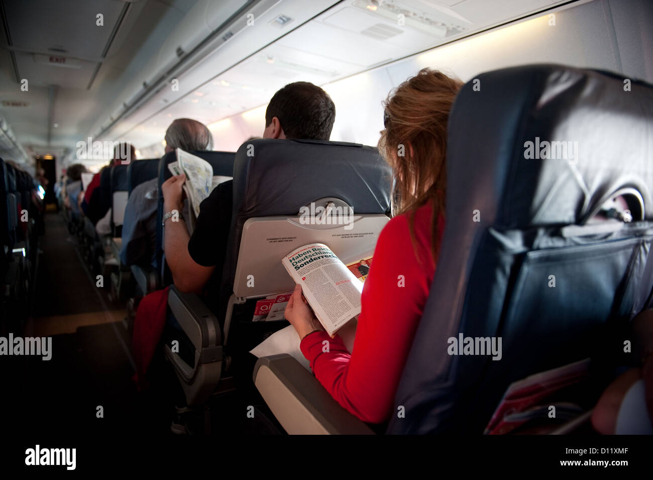 Passengers in airplane hi-res stock photography and images - Alamy
