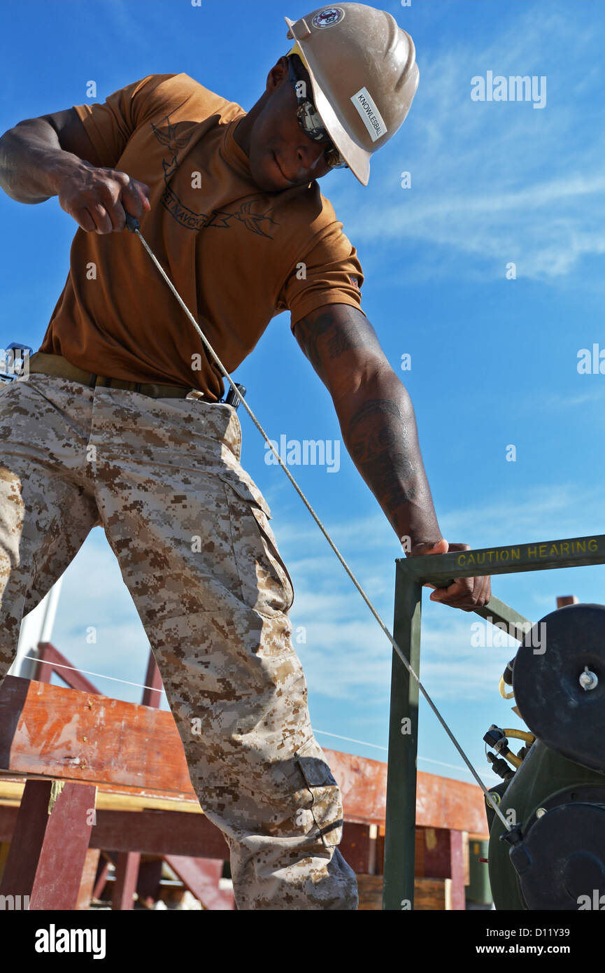 Builder Construction man Xavier Knowlesball, assigned to Naval Mobile Construction Battalion (NMCB) Stock Photo