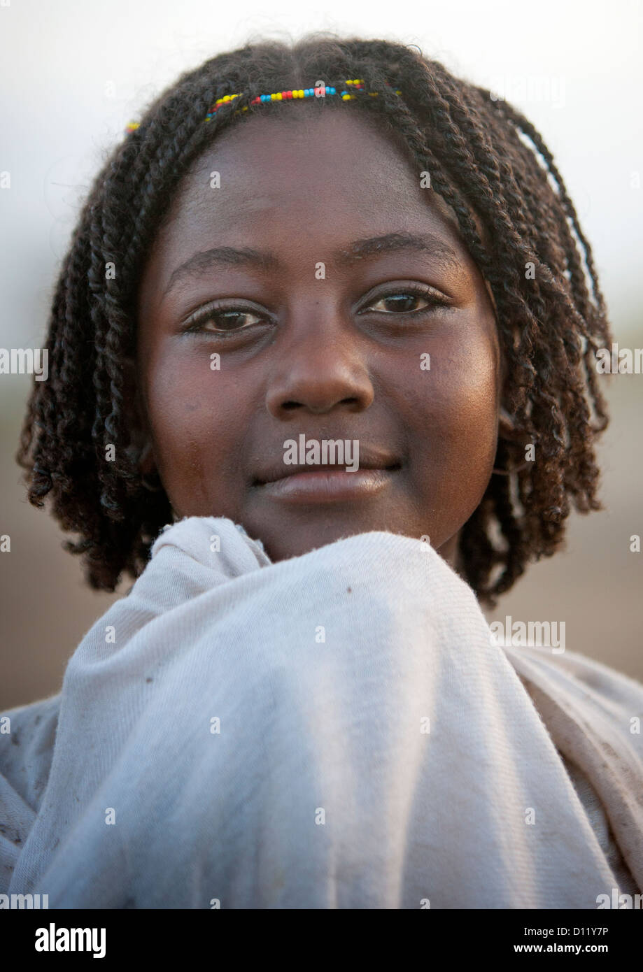 Portrait Of A Smiling Karrayyu Tribe Girl With Stranded Hair At Gadaaa ...