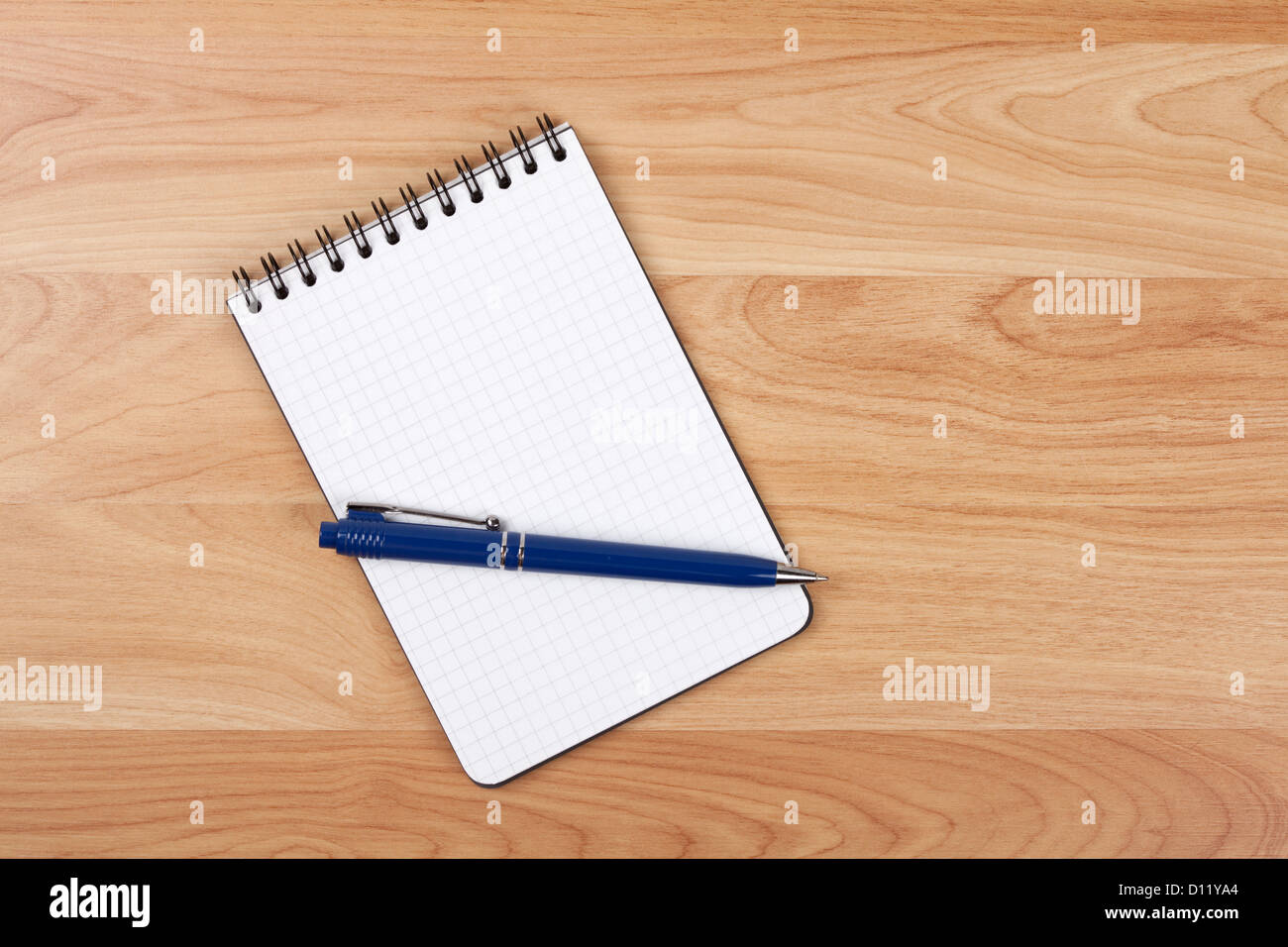 Blank notepad with pen on wood table Stock Photo - Alamy