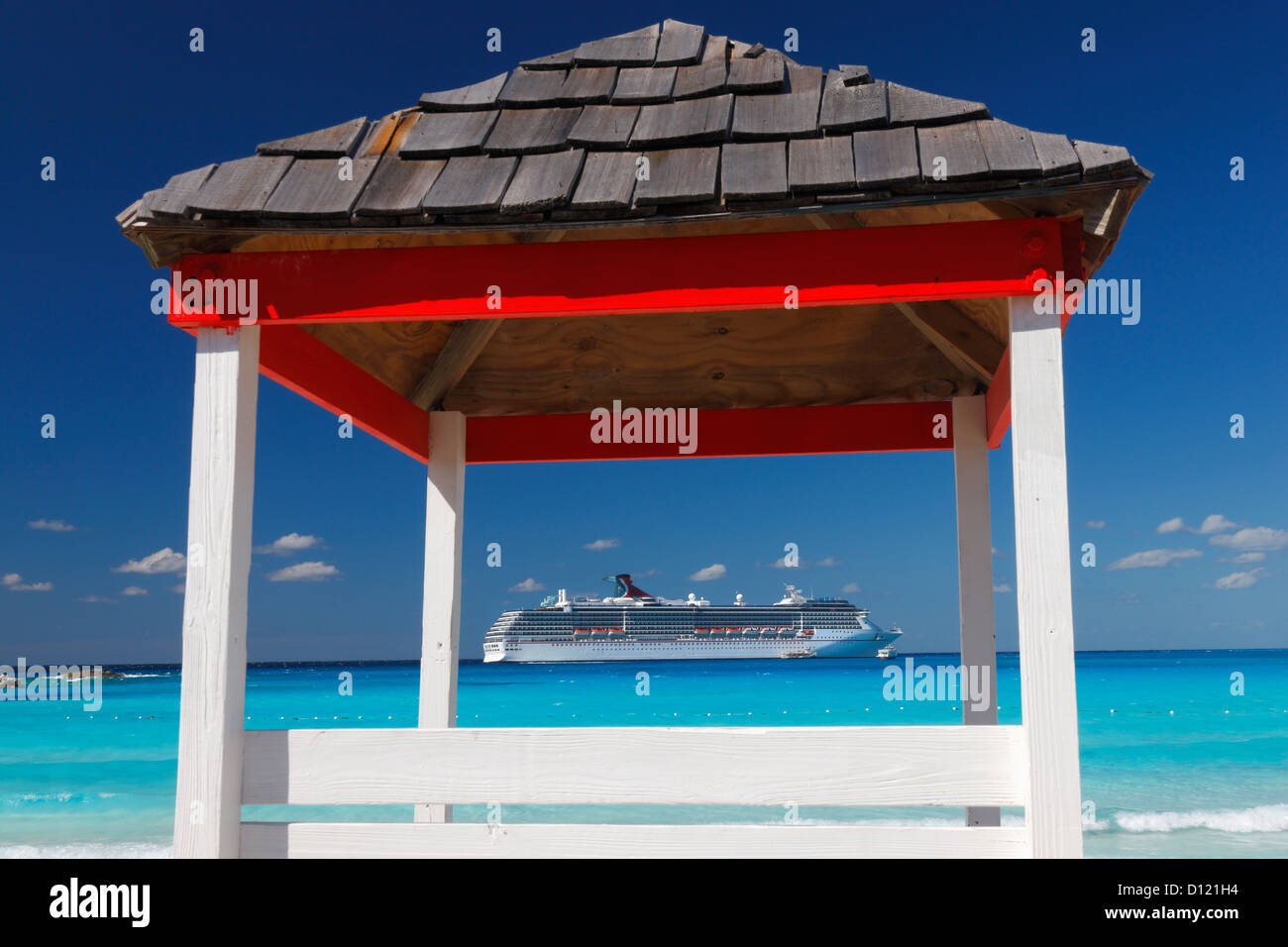 Lifeguard hut and Cruise line ship near Caribbean sea, Bahamas Stock Photo