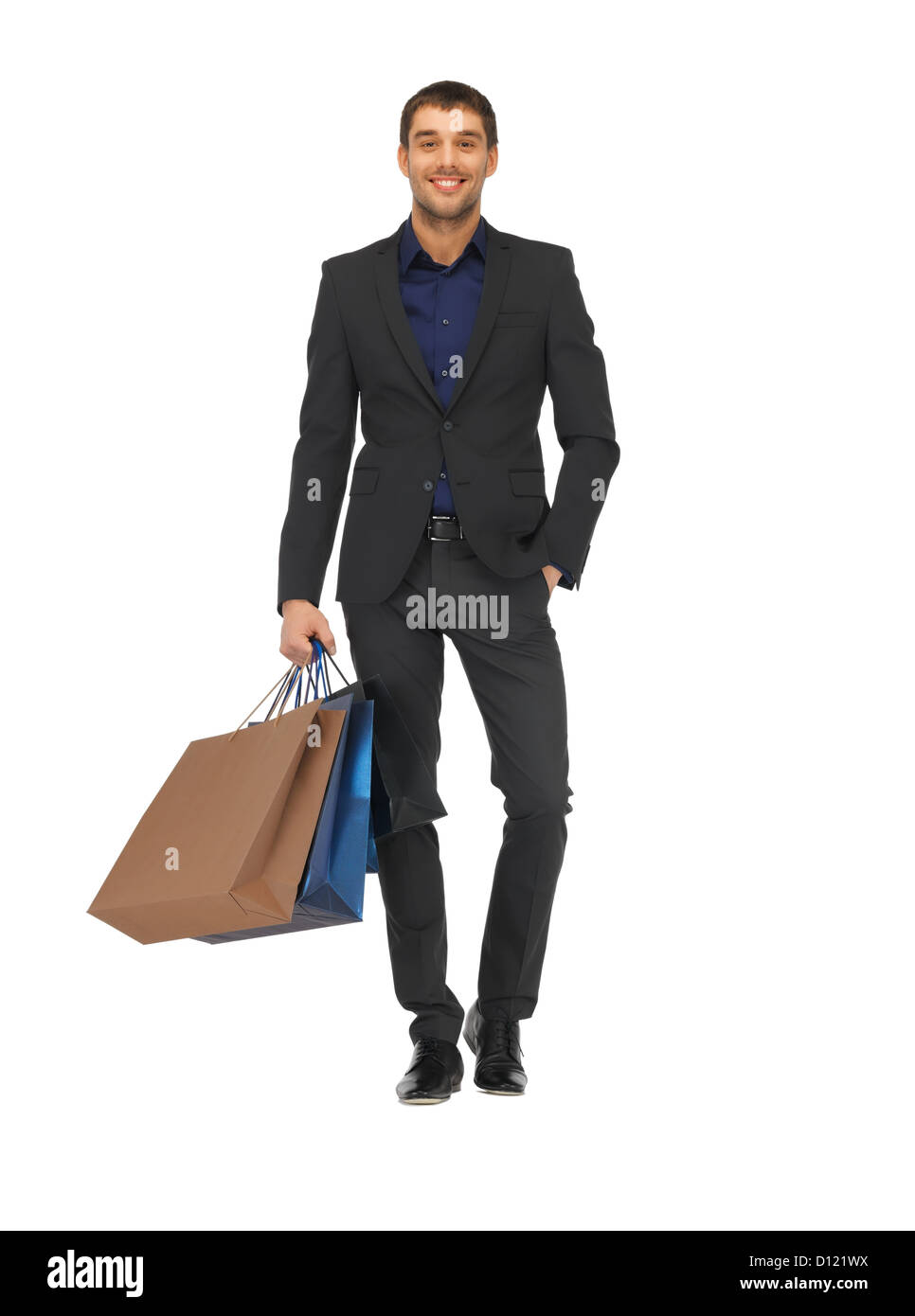 handsome man in suit with shopping bags Stock Photo
