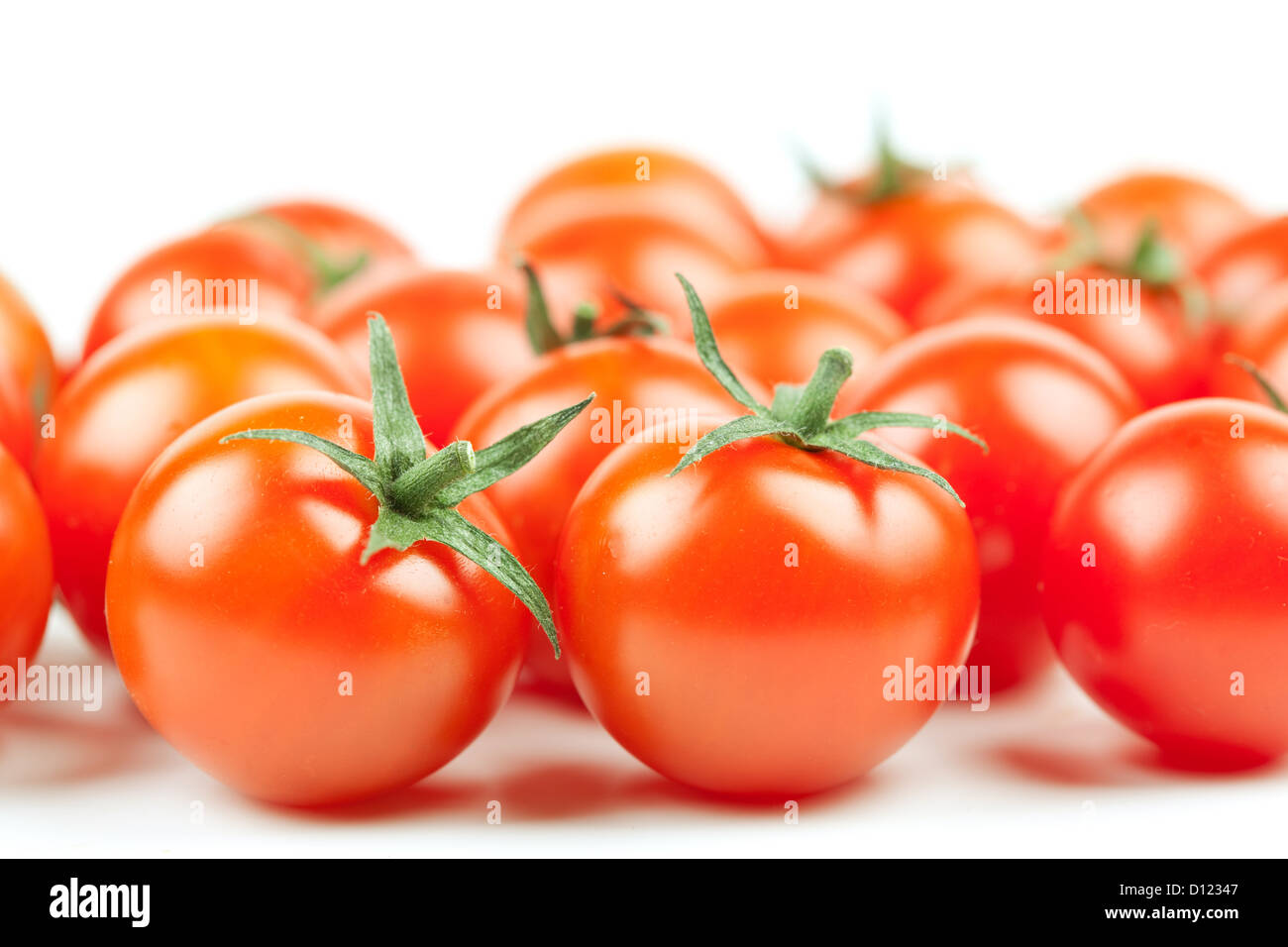 Many Fresh Cherry Tomatoes on white background Stock Photo - Alamy