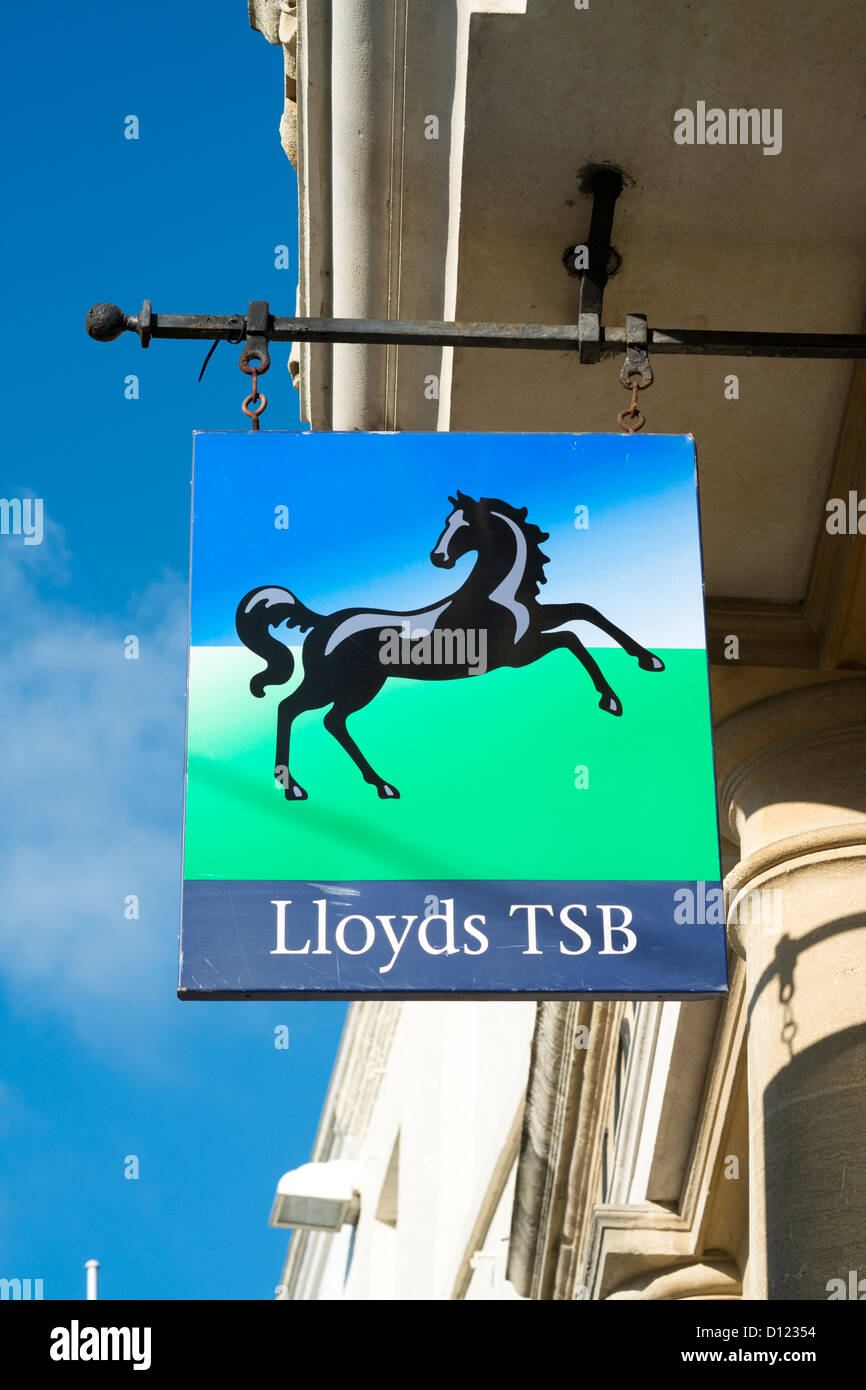 Looking up at Lloyds TSB bank overhead sign with black horse log on UK high street Stock Photo