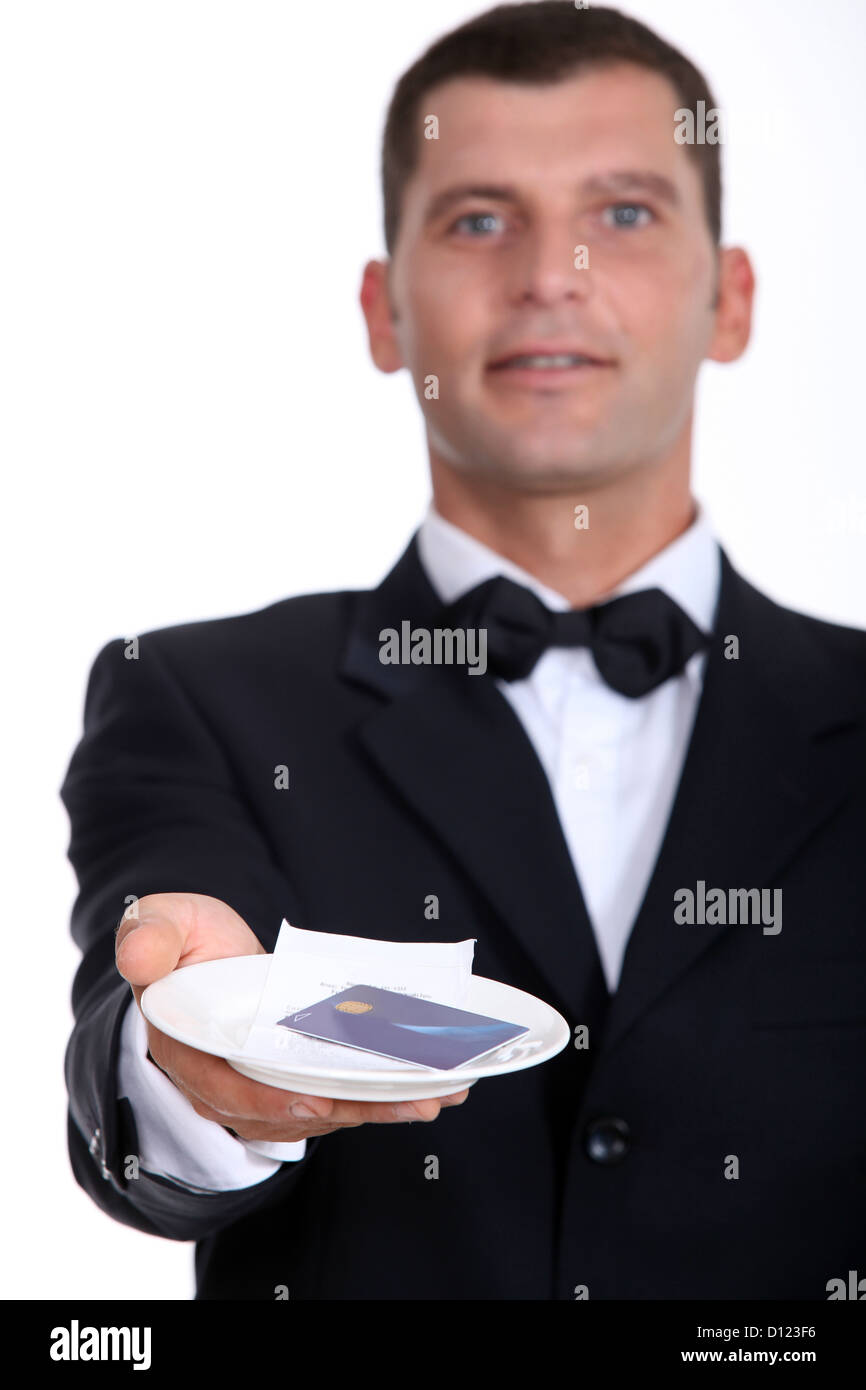 Male waiter holding creditcard and receipt Stock Photo Alamy
