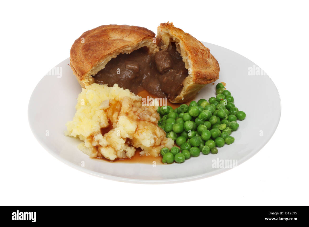 Beef pie mashed potato and peas on a plate isolated against white Stock