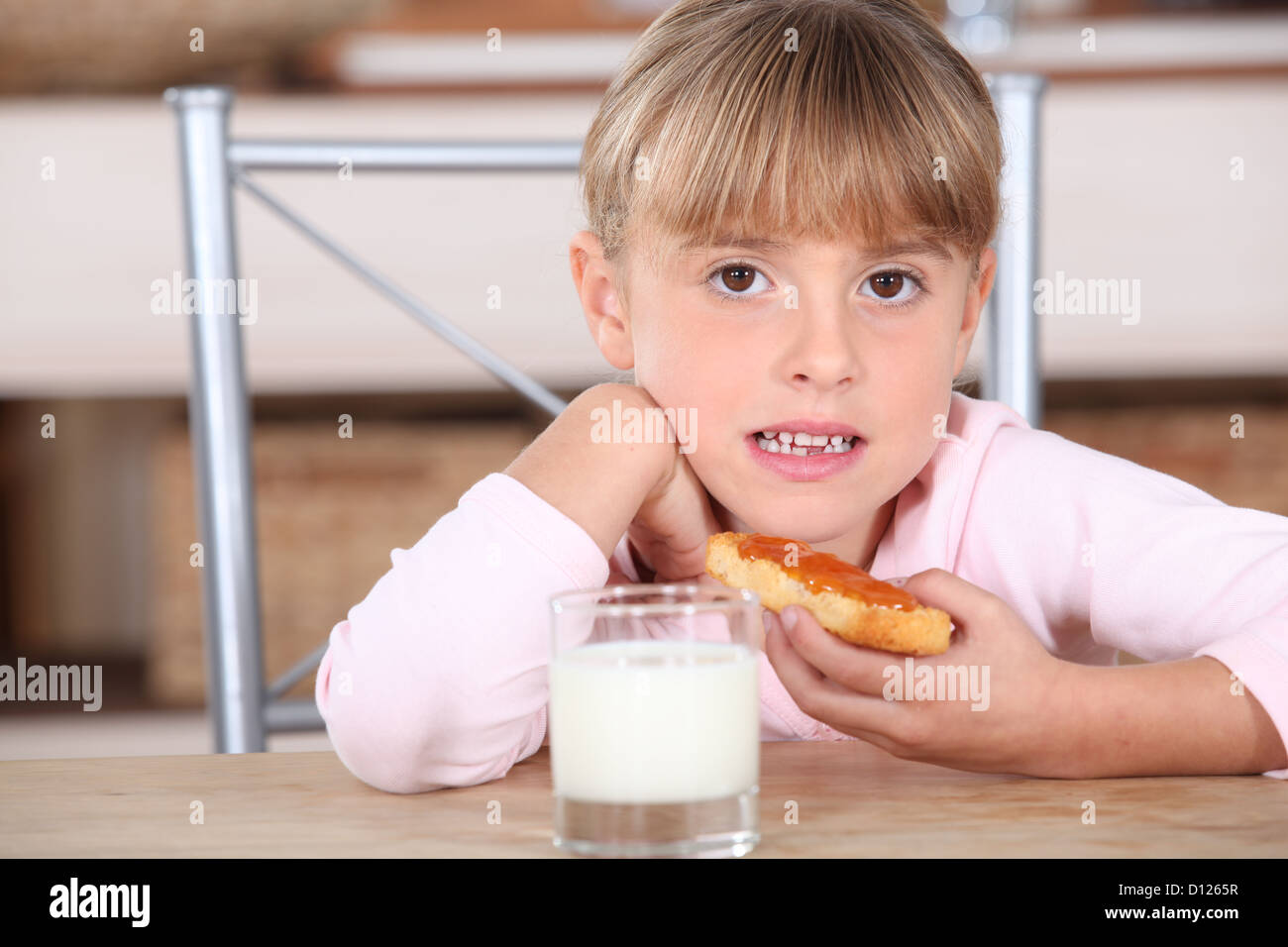 Little girl with jam and milk Stock Photo Alamy