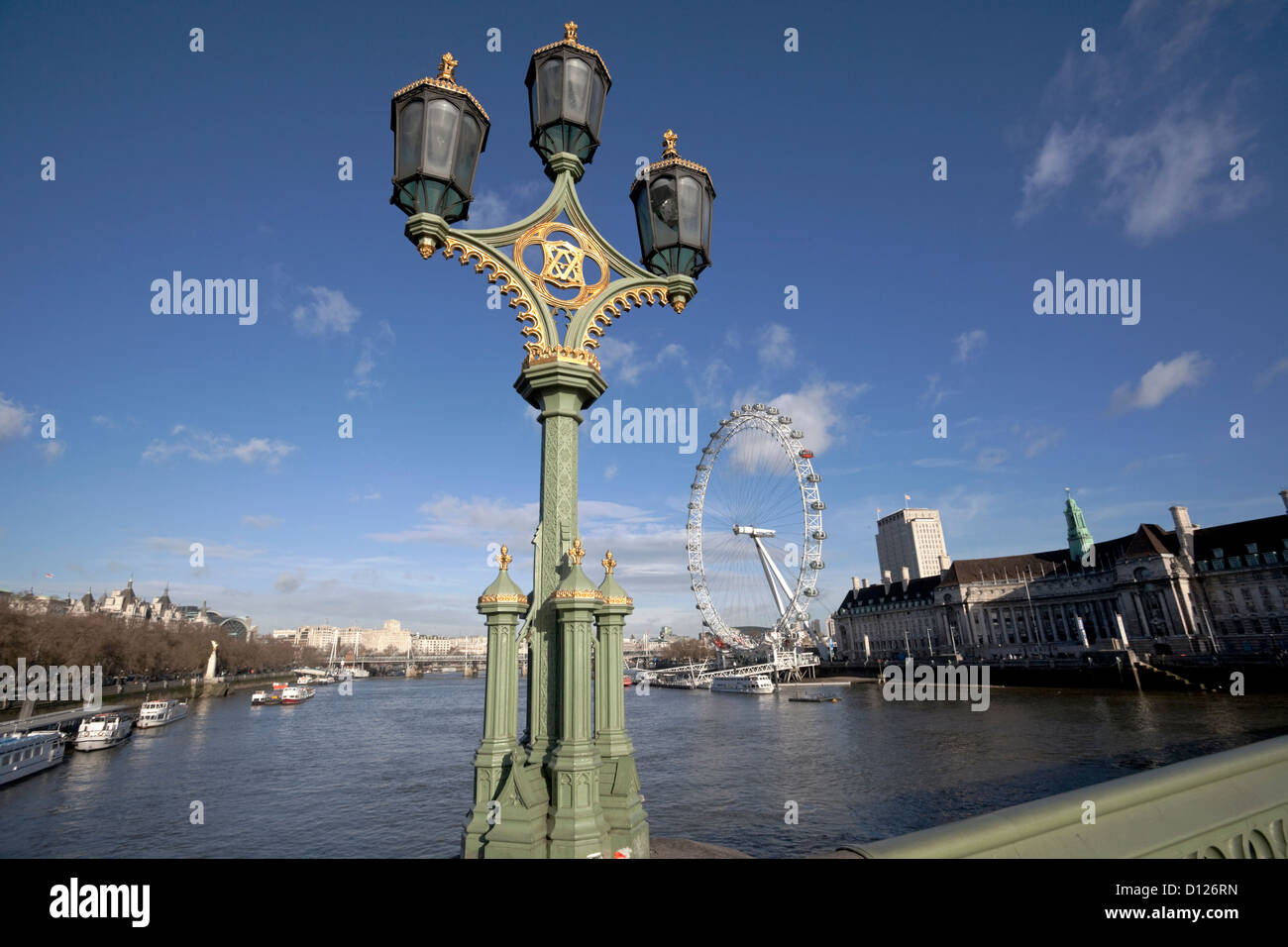 Lamp post on Westminster Bridge and view of River Thames and the London Eye, London, England, UK Stock Photo