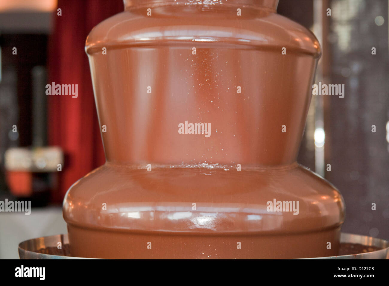 Chocolate fondue with warm milk chocolate. Stock Photo