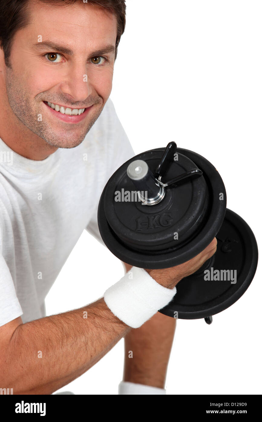 Man lifting weights Stock Photo - Alamy