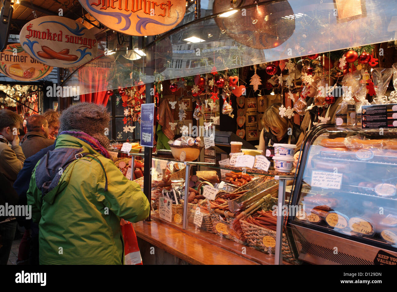 People buying food at a market stall at the Birmingham Christmas Market UK Stock Photo