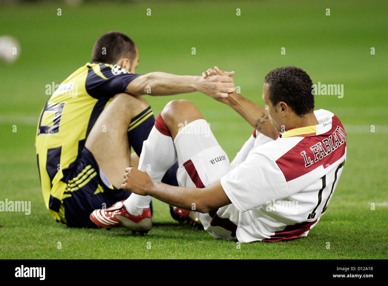 Seville, Spain, football players help each other out Stock Photo