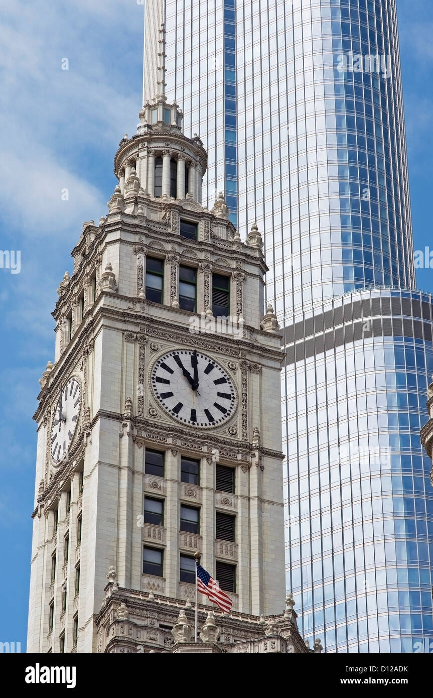 A Clock Tower With The American Flag Beside A Skyscraper; Chicago