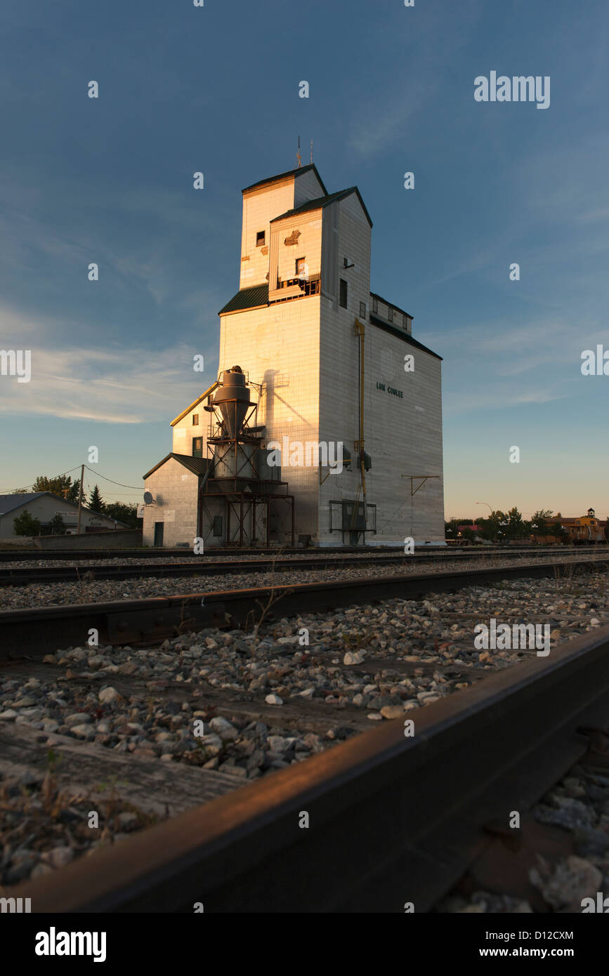 Grain Elevator And Train Tracks; Plum Coulee Manitoba Canada Stock Photo