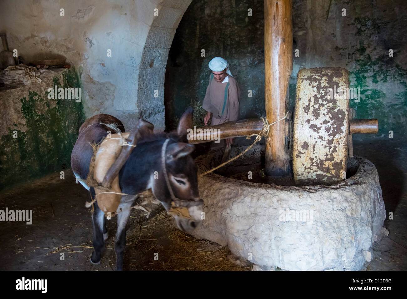 Millstone & donkey used for pressing olives to make olive oil in