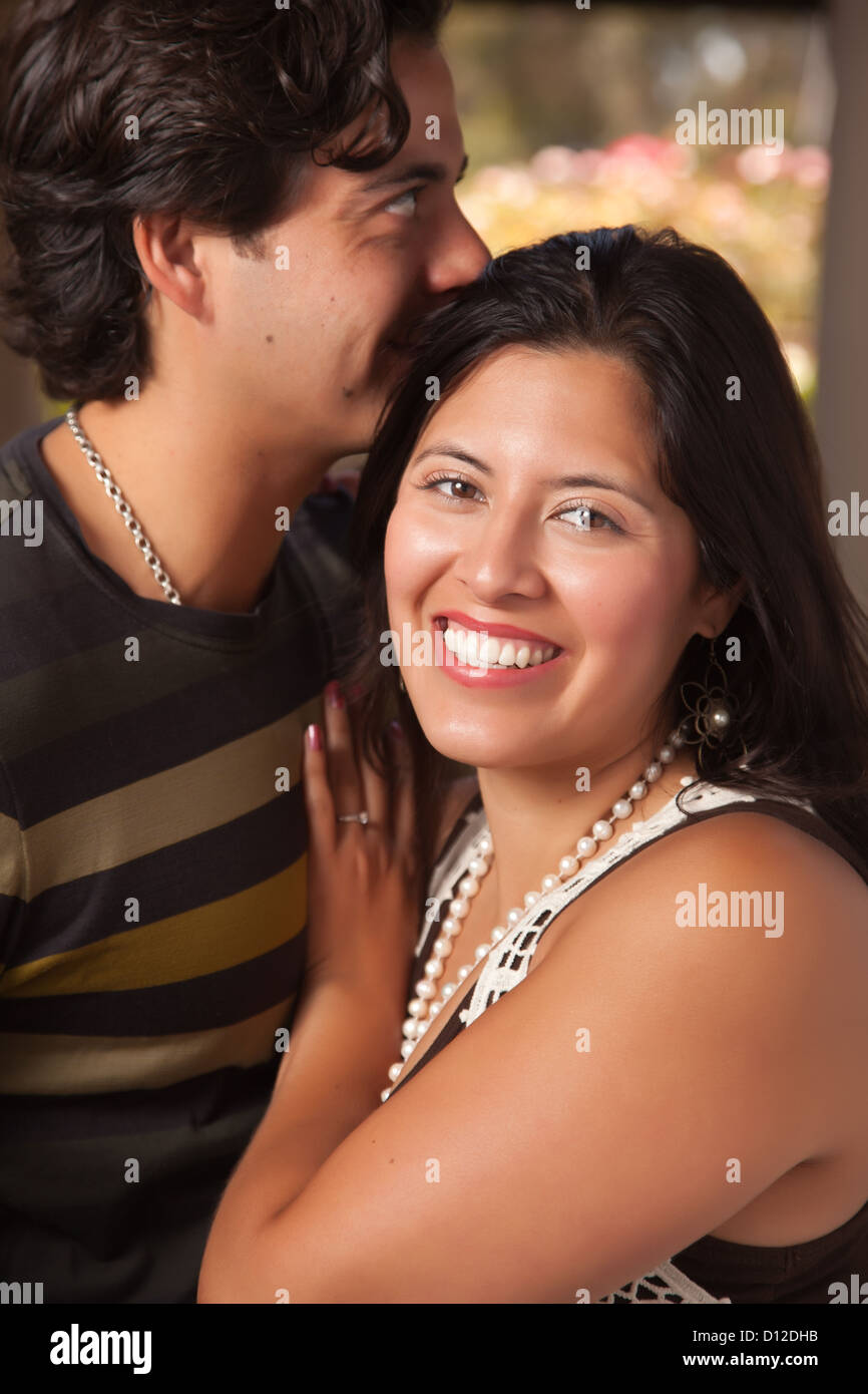 Attractive Hispanic Couple Portrait Enjoying Each Other Outdoors Stock