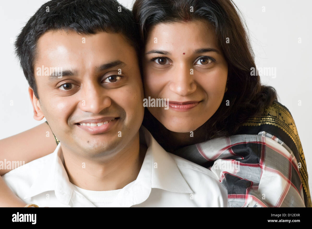 Happy Indian ethnicity couple posing. Stock Photo