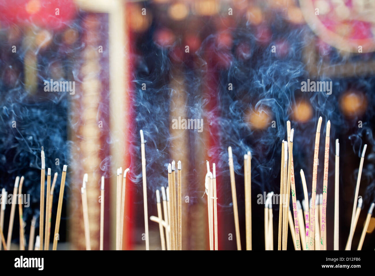 Incense left burning by worshipers at Wong Tai Sin Temple. Also known as Sik Sik Yuen Wong Tai Sin Temple in Hong Kong Stock Photo