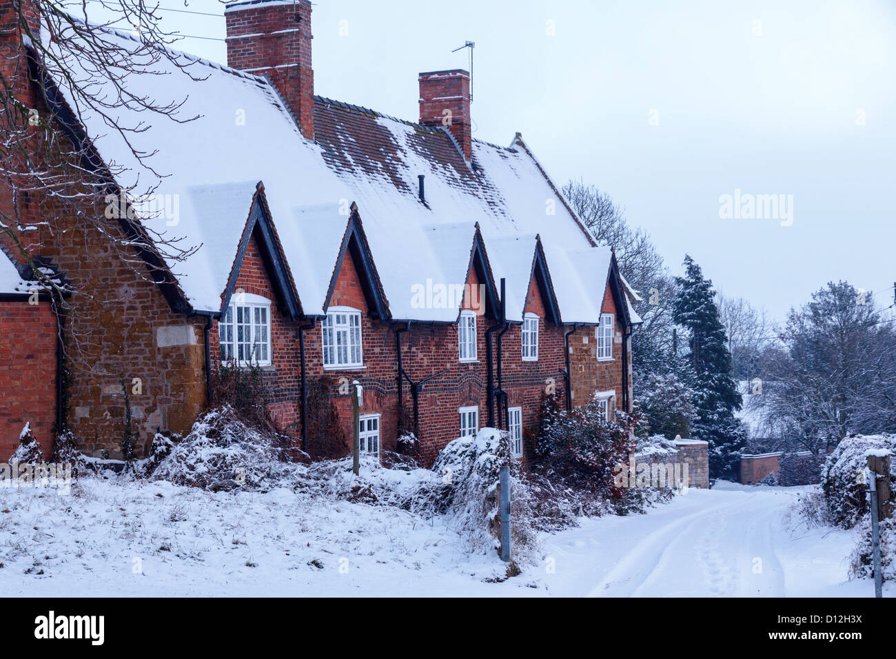 Old red brick and stone gabled house in snow Pepper s Farm