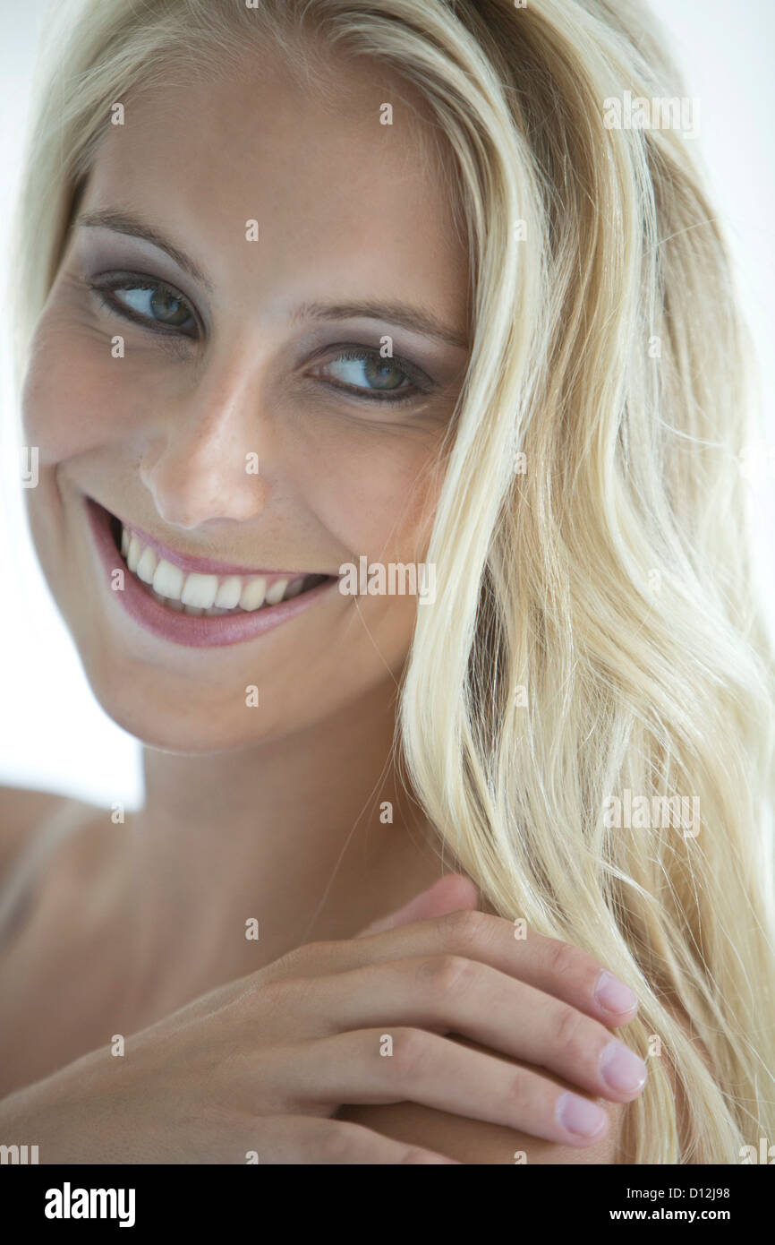 Close up of young woman, smiling Stock Photo - Alamy