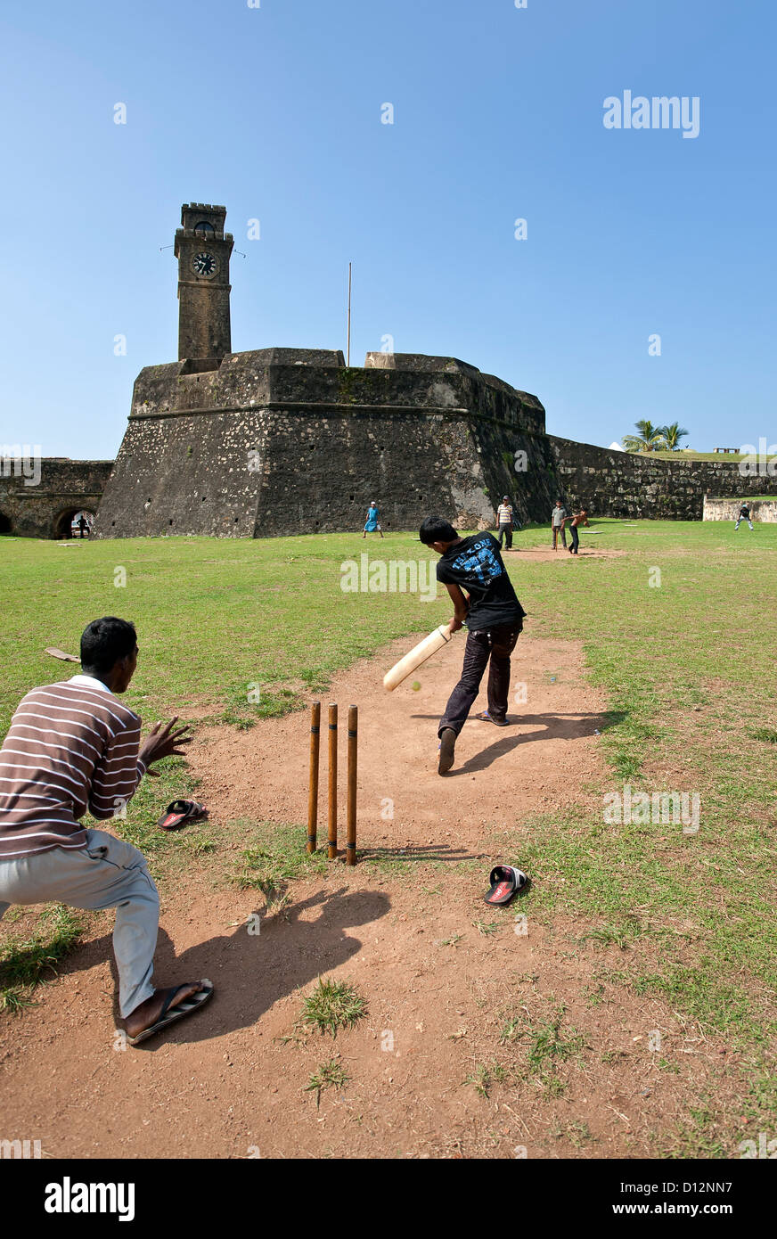 Men playing cricket. Galle Fort. Sri Lanka Stock Photo