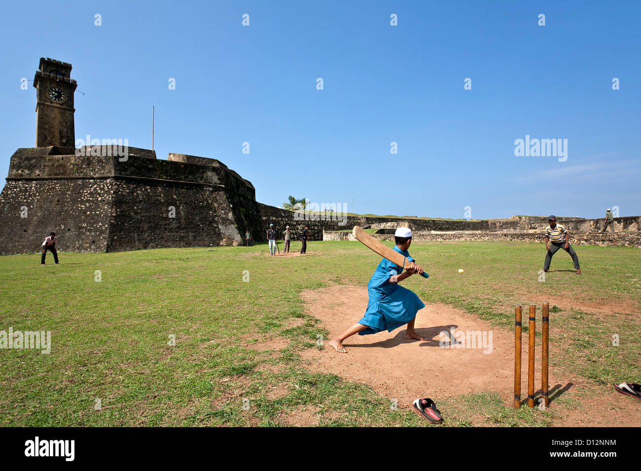 Boys playing cricket. Galle Fort. Sri Lanka Stock Photo