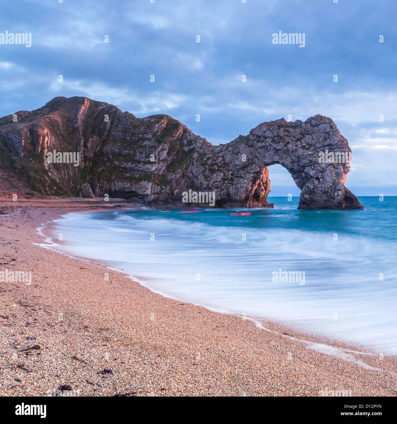 Durdle door with two red kayak's Stock Photo