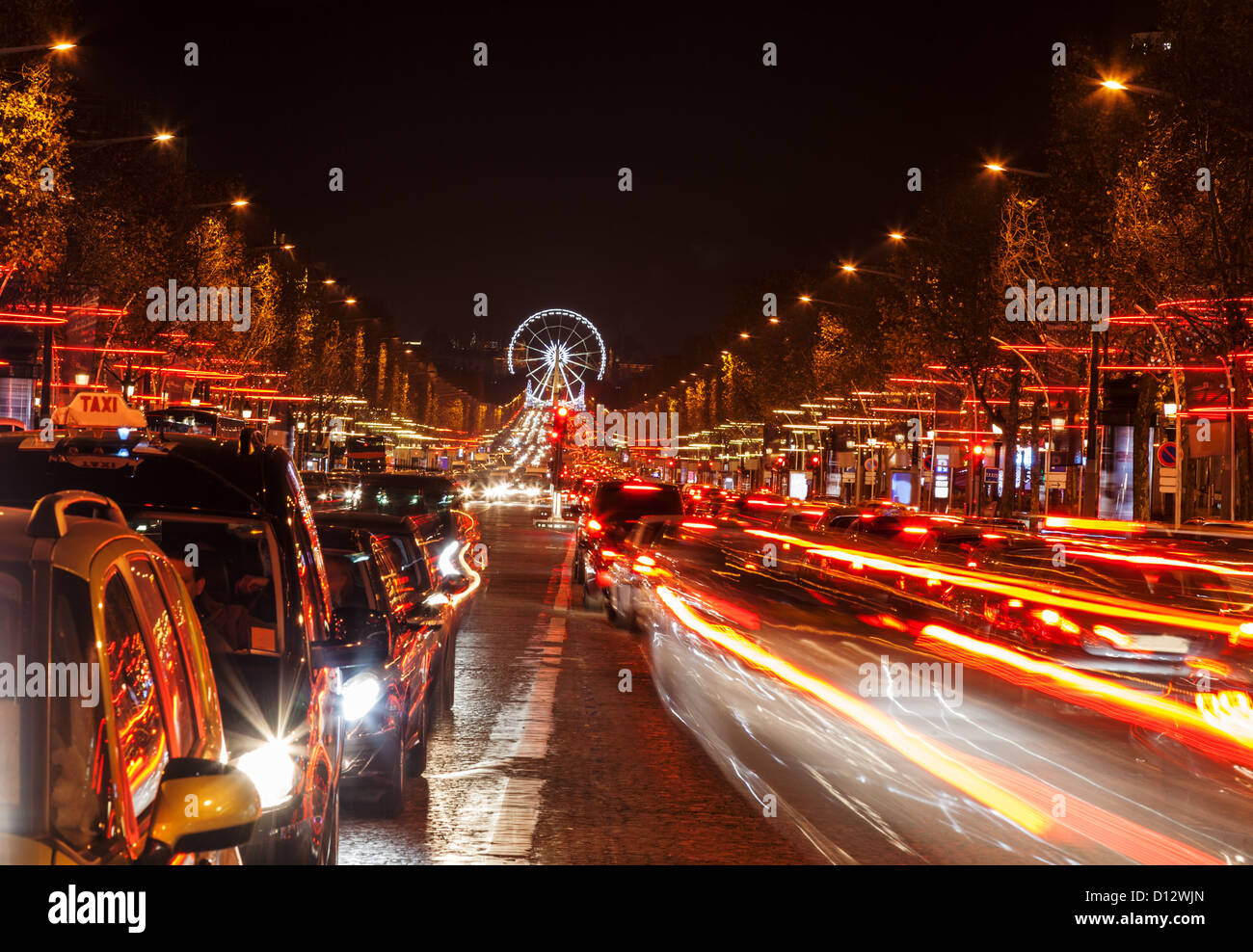 December illumination and traffic lights on the Avenue des Champs-Élysées in Paris,Europe. Stock Photo