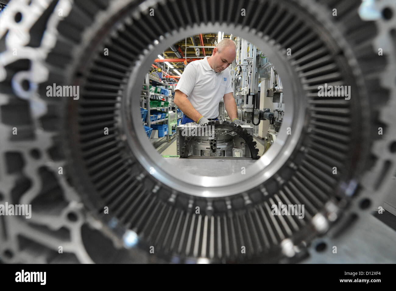 Employee Rudolf Himmelspach installs a gearbox at the ZF Friedrichshafen AG factory in Friedrichshafen, Germany, 29 November 2012. Photo: Felix Kaestle Stock Photo