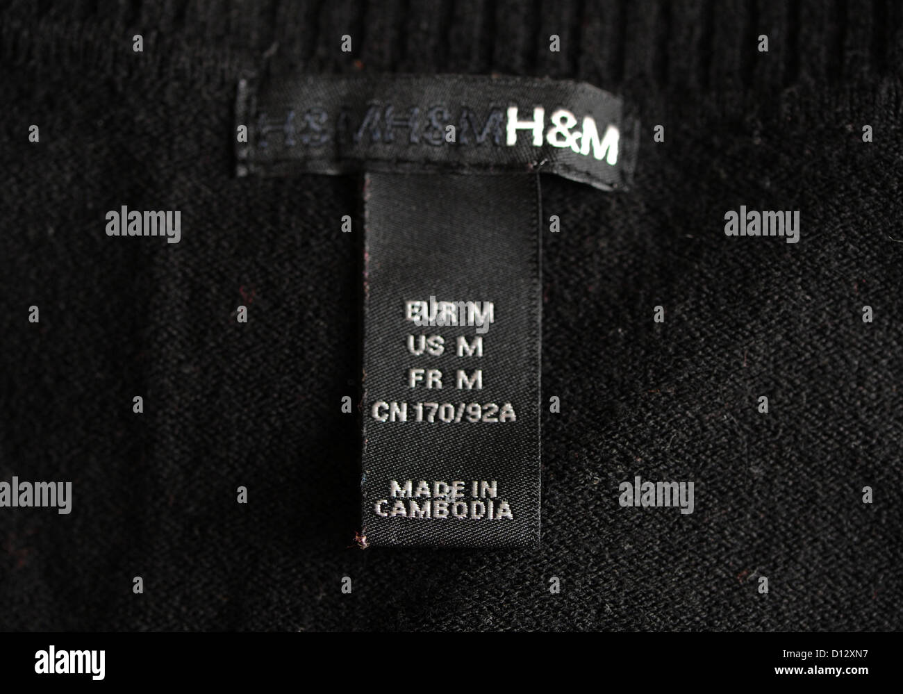 A clothing tag on a jumper from Swedish clothing retailer 'Hennes and  Mauritz H&M' shows the respective country of origin 'Made in Cambodia' in  Berlin, Germany, 27 November 2012. Photo: Jens Kalaene