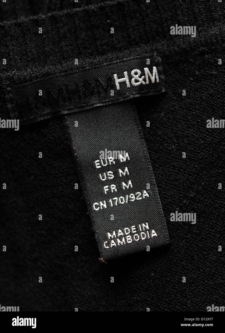 A clothing tag on a jumper from Swedish clothing retailer 'Hennes and ...
