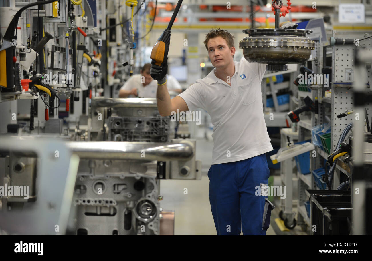 Employee Felix Glau installs a gearbox at the ZF Friedrichshafen AG factory in Friedrichshafen, Germany, 29 November 2012. Photo: Felix Kaestle Stock Photo