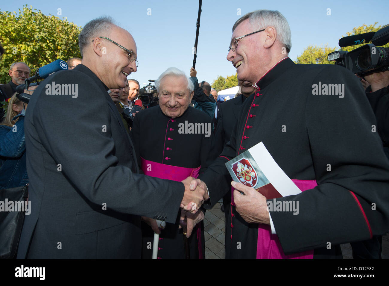 FILE - A file photo dated 22 September 2012 shows dogmatics professor Rudolf Voderholzer (L-R), the Pope's brother Georg Ratzinger and Dompropst Wilhelm Gegenfurtner in Pentling, Germany. Reports state that Voderholzer will succeed Regensburg Bishop Gerhard Ludwig Mueller who had been called to Rome. Photo: Armin Weigel Stock Photo