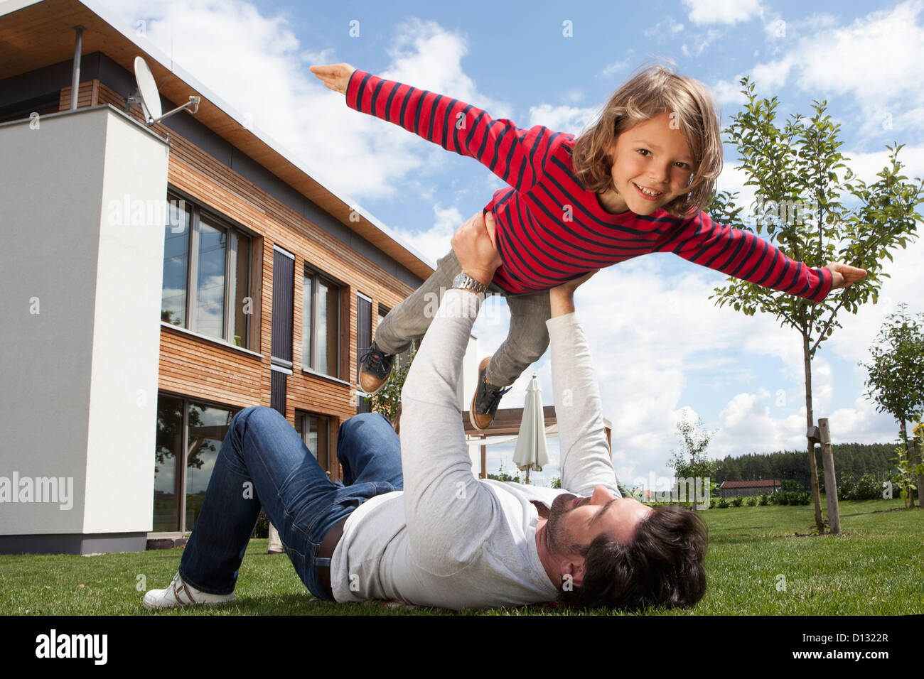 Germany, Bavaria, Nuremberg, Father balancing his son Stock Photo Alamy
