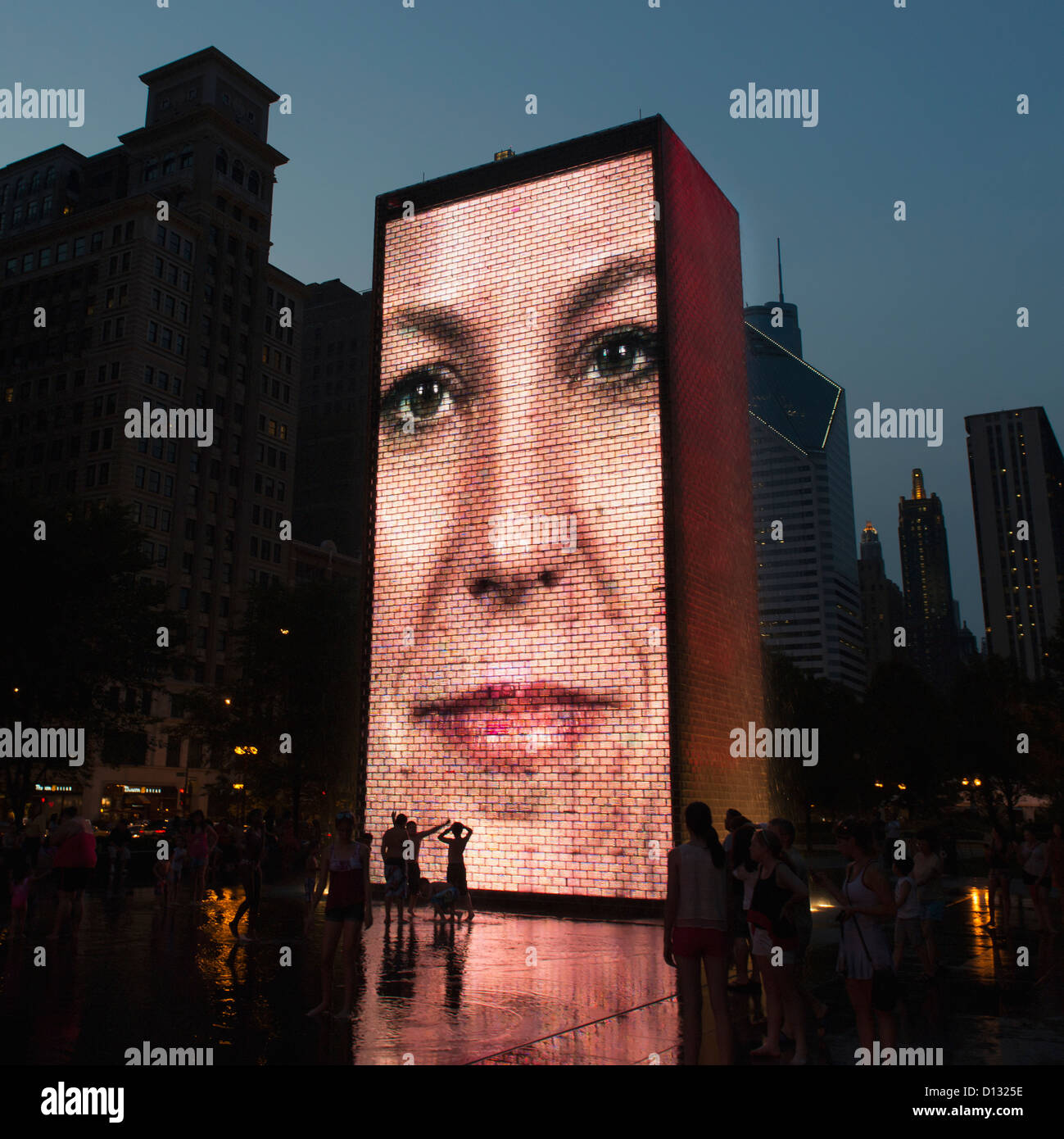 Image Of A Woman's Face Projected On The Side Of A Building; Chicago