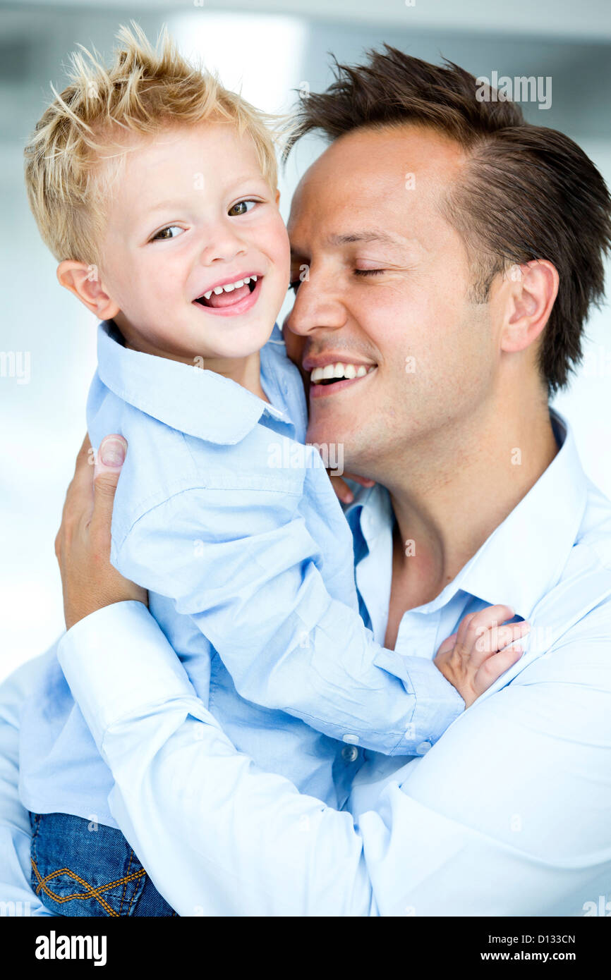 Germany, Father carrying son, smiling Stock Photo Alamy