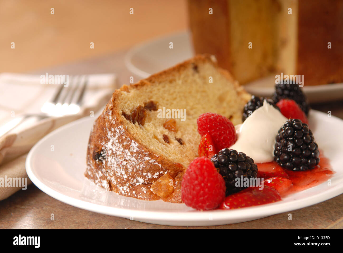 Freshly baked Italian Panettone Christmas Bread with fruit and a slice cut out Stock Photo