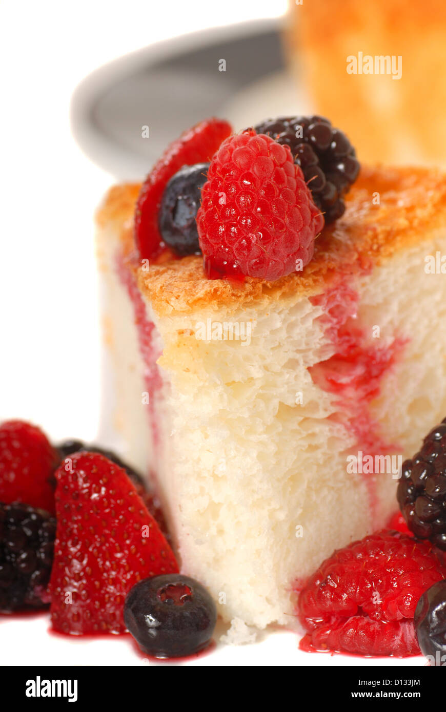 Slice of freshly baked Angel Food Cake with fresh fruit Stock Photo