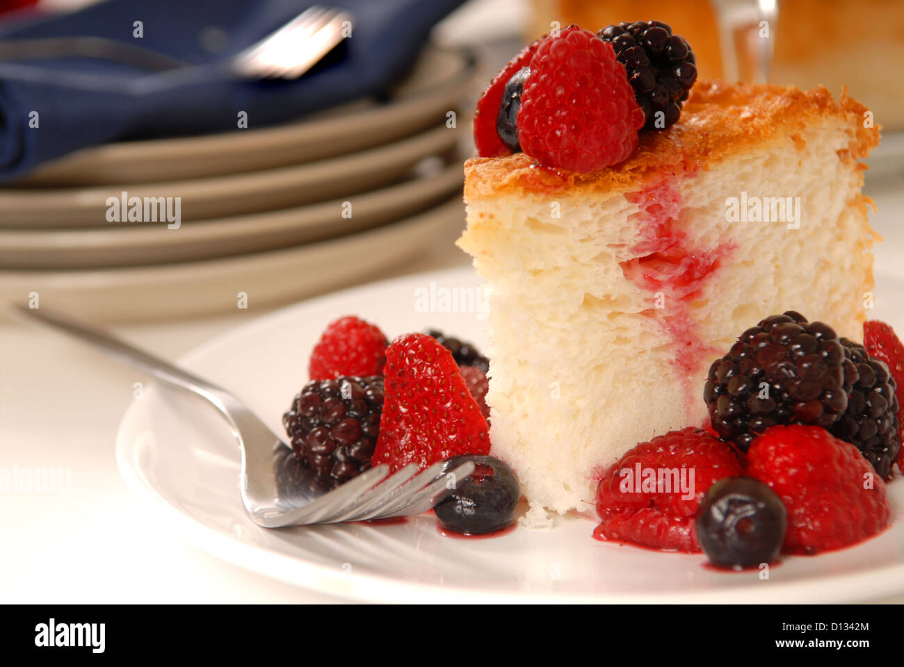 Slice of freshly baked Angel Food cake with fresh fruit Stock Photo