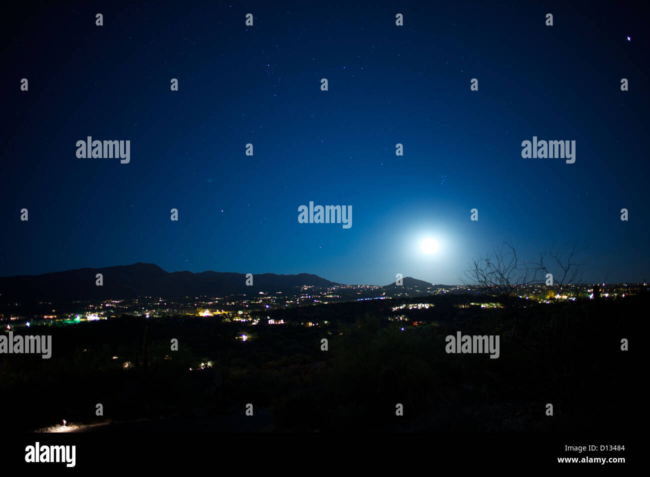 View of city and hills at night Stock Photo