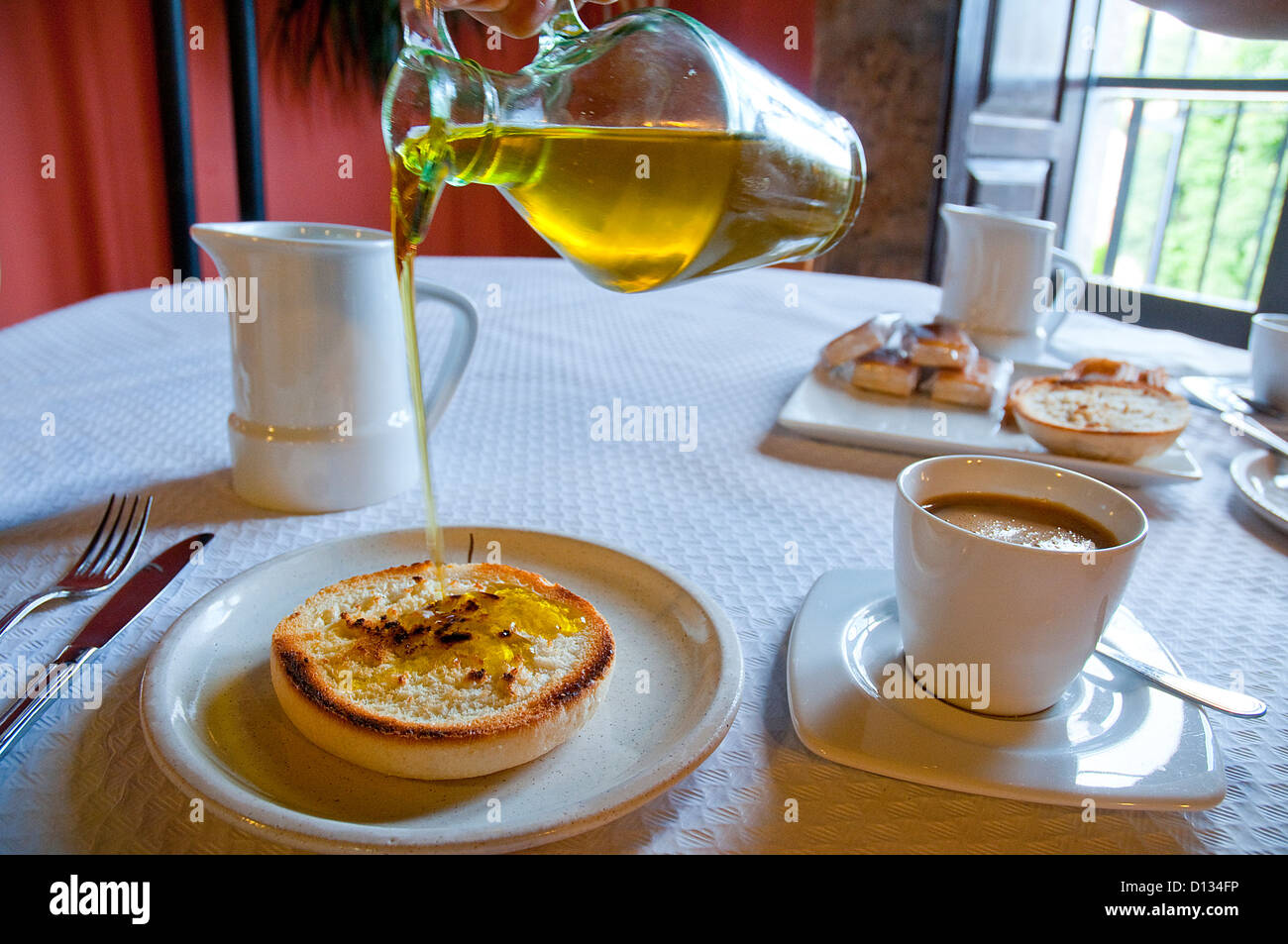Olive oil on toast for breakfast. Spain. Stock Photo