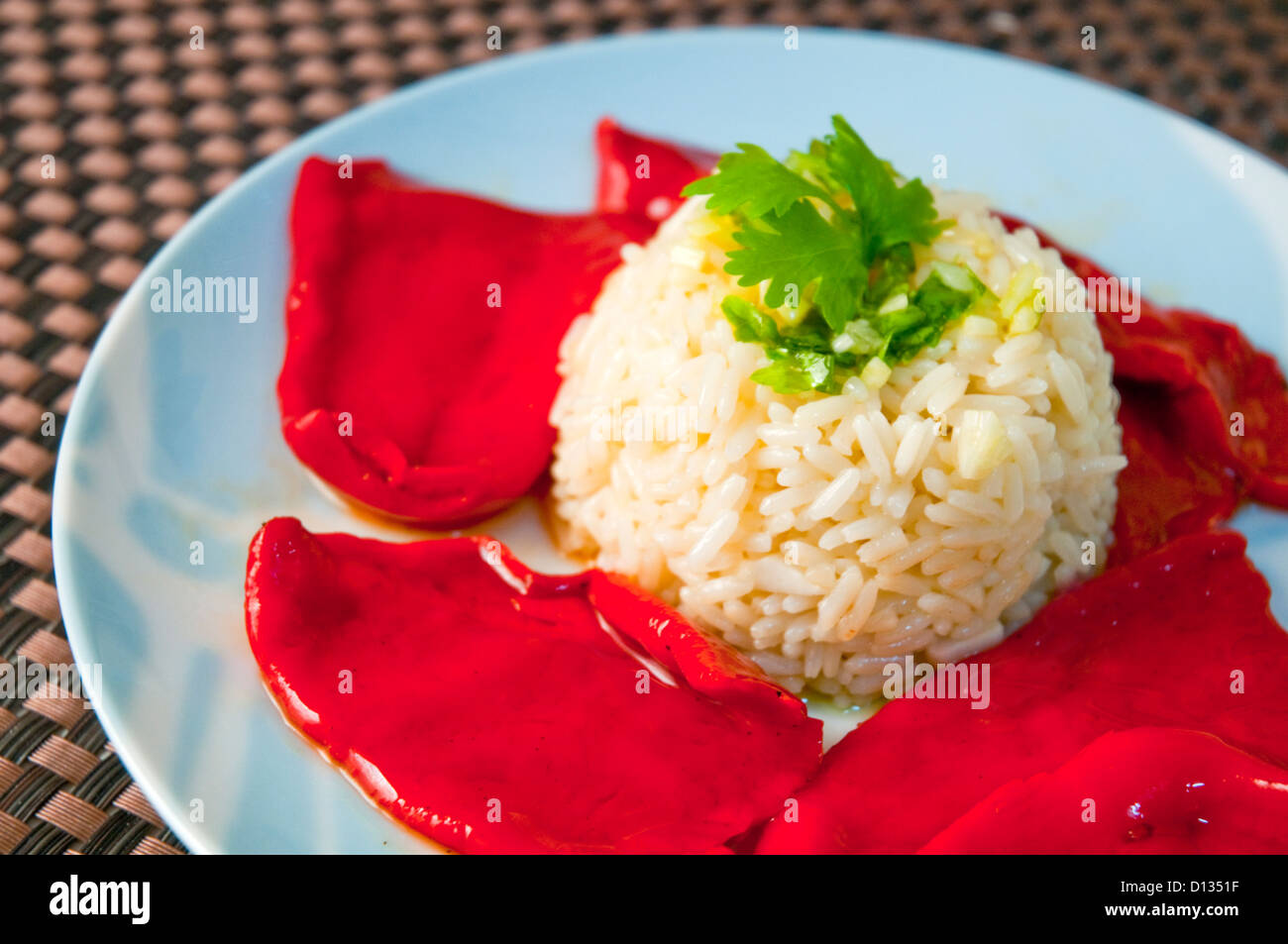 Rice with red peppers. Close view. Stock Photo