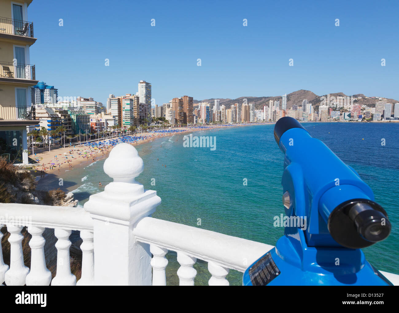 Telescope At A Railing With A Viewpoint To Leavante Beach; Benidorm Alicante Province Costa Blanca Spain Stock Photo
