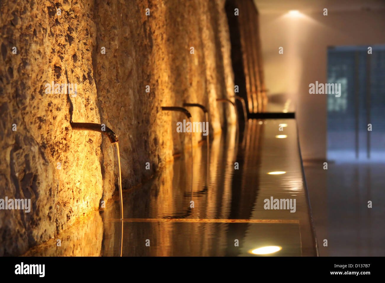 fountain at night, lit atmospherically, Rivoltella on Lake Garda, Region of Brescia, Lombardy, Italy Stock Photo