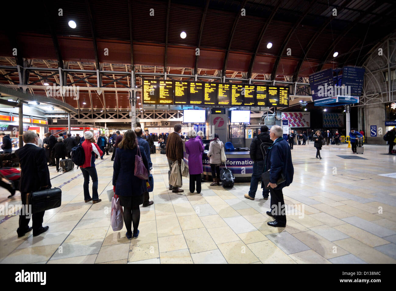 Travelers check the departure information boards, Paddington Railway Station, London, England, UK Stock Photo