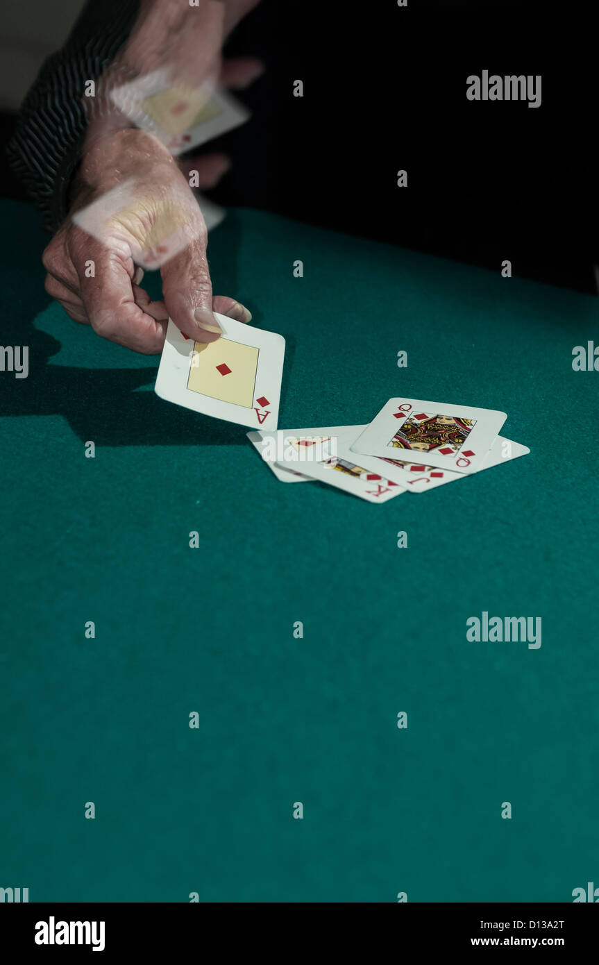 Laying the winning ace with a flourish Stock Photo