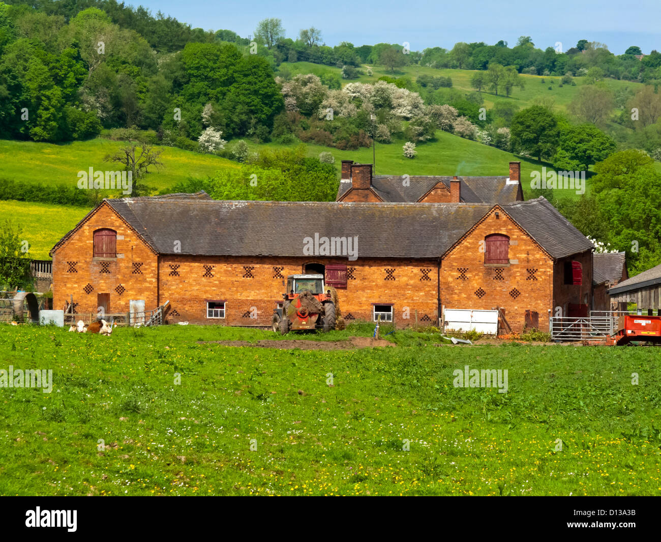 Traditional farm with red brick buildings at Hawksmoor in the Churnet Valley Staffordshire England UK Stock Photo